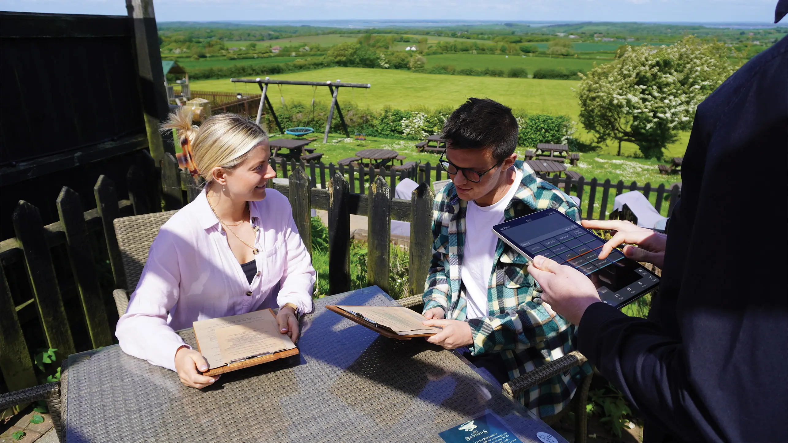 Server using a PocketTouch handheld in the garden